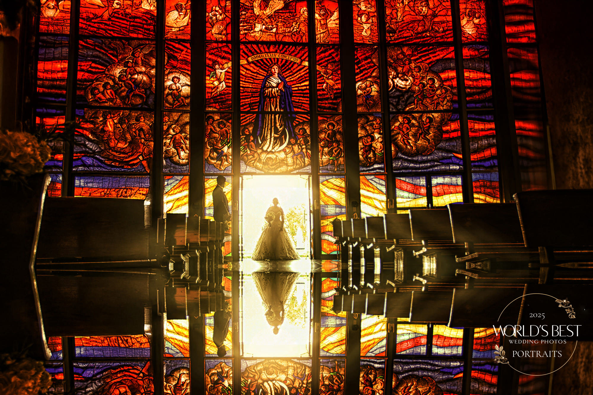 Award-Winning Bridal Entrance at Church Ceremony | Victoria Machin Photography Bride entering a church with stained glass backdrop during wedding ceremony – award-winning portrait by Victoria Machin Photography