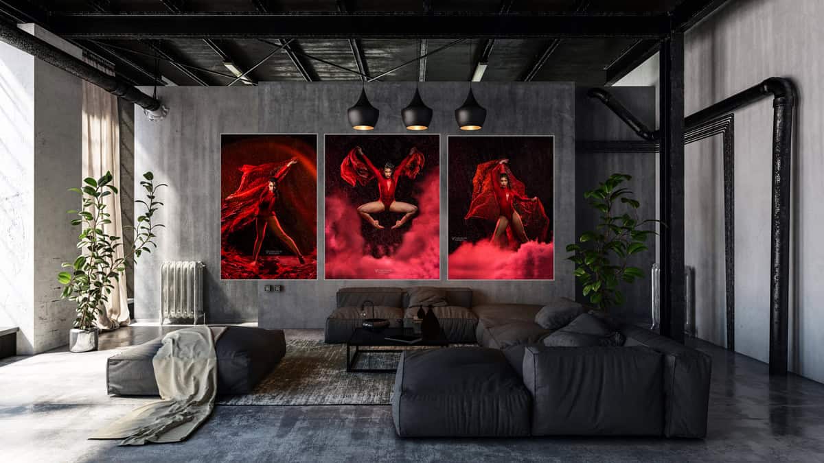 Fine-art triptych of a dancer in red displayed above a sofa in a modern loft living room