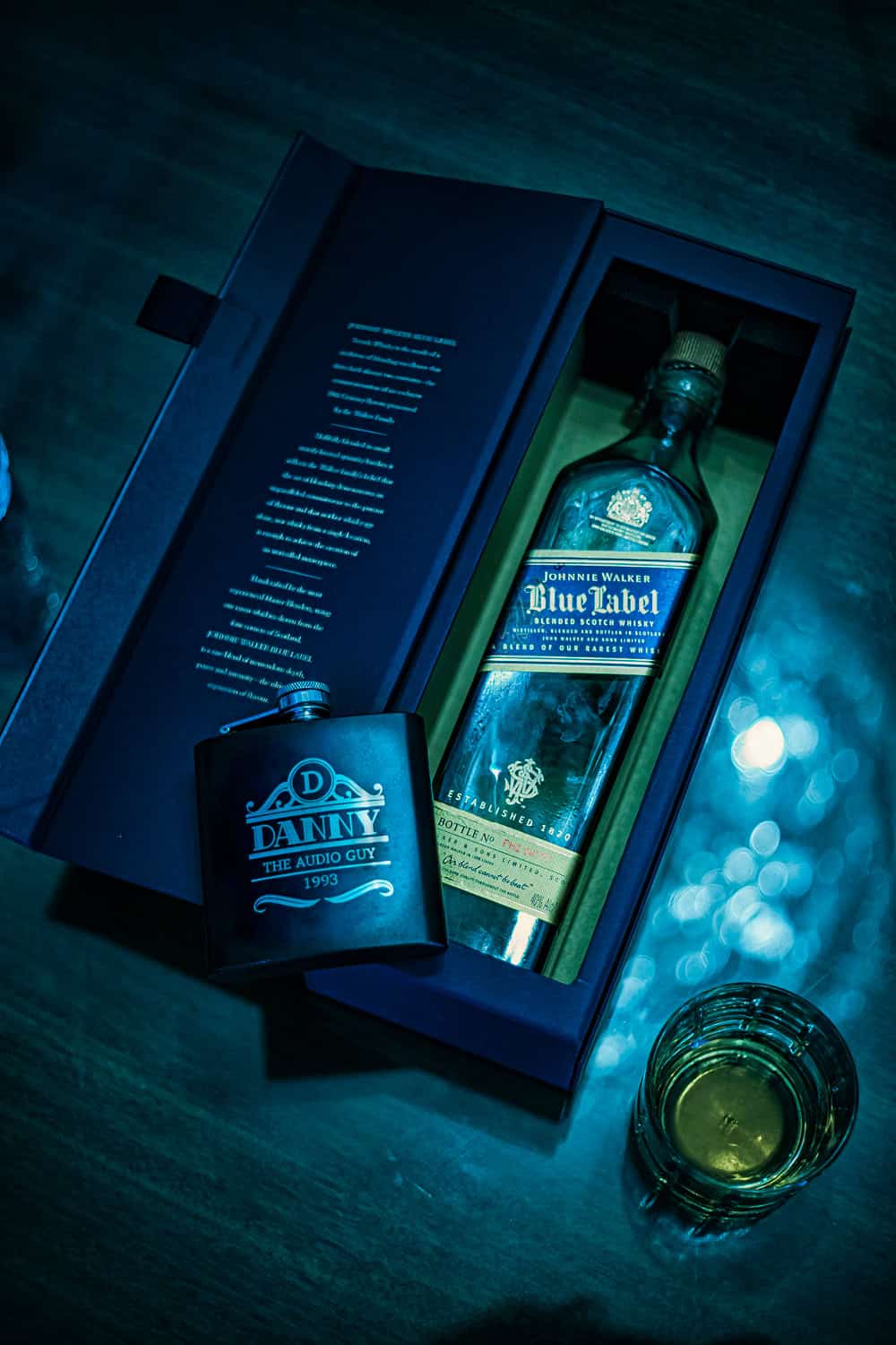 Groom’s gift: Johnnie Walker Blue Label and an engraved flask in blue light